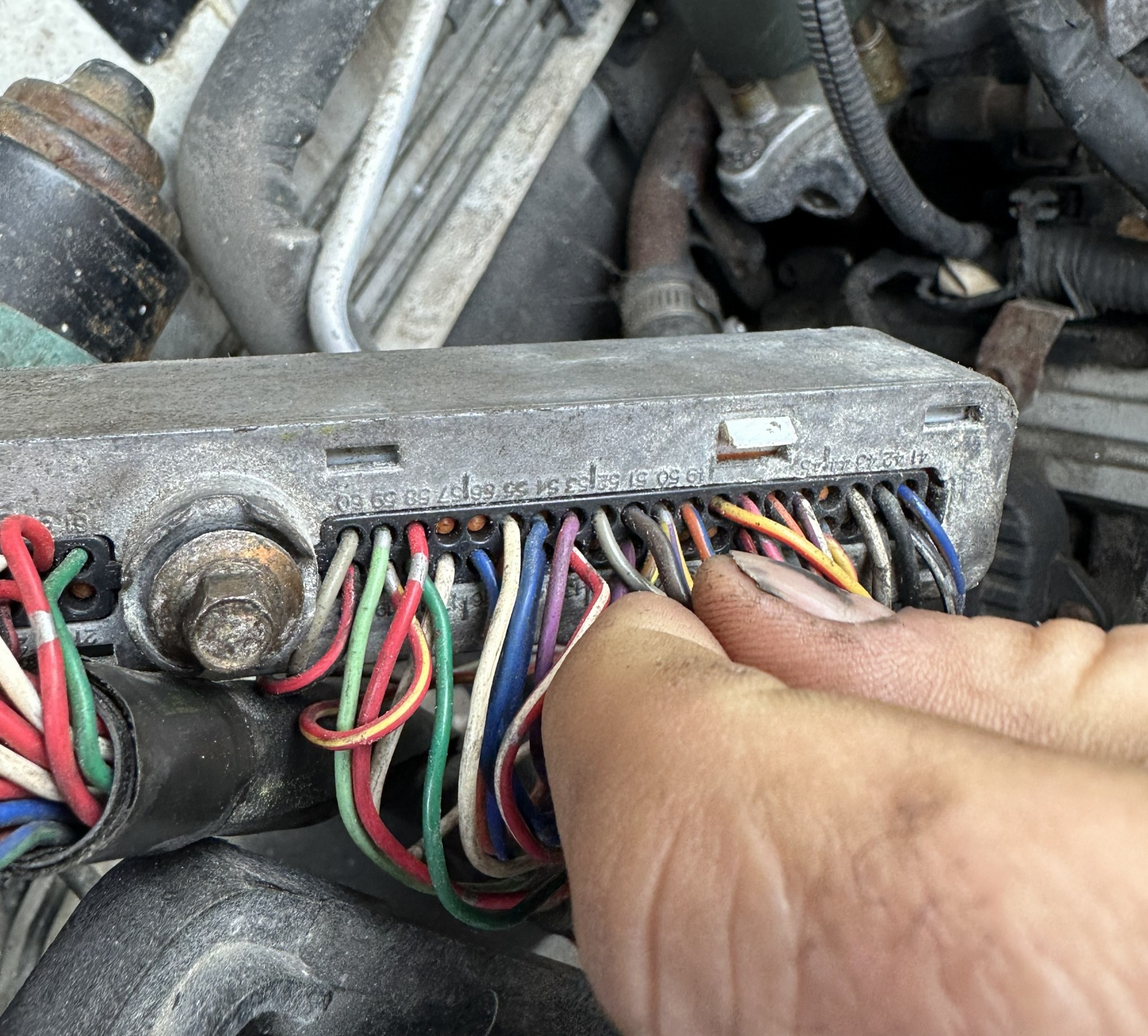 Hands-on inspection of a vehicle electrical connector and wiring